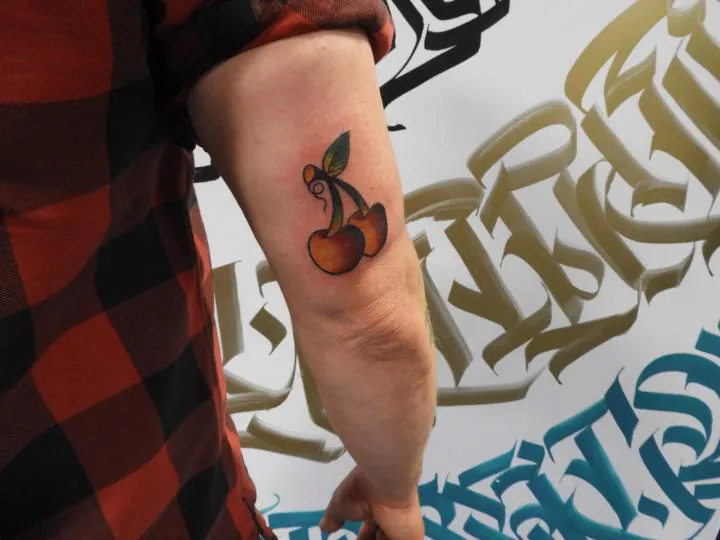 Cherries tattoo by Keith, Calgary Tattoo Company